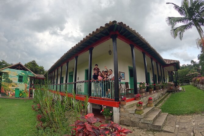 The long veranda of a colonial coffee hacienda, painted red and white