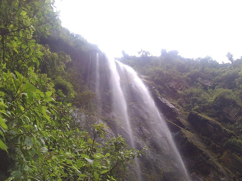A waterfall dropping through forest in the Cundinamarca hills