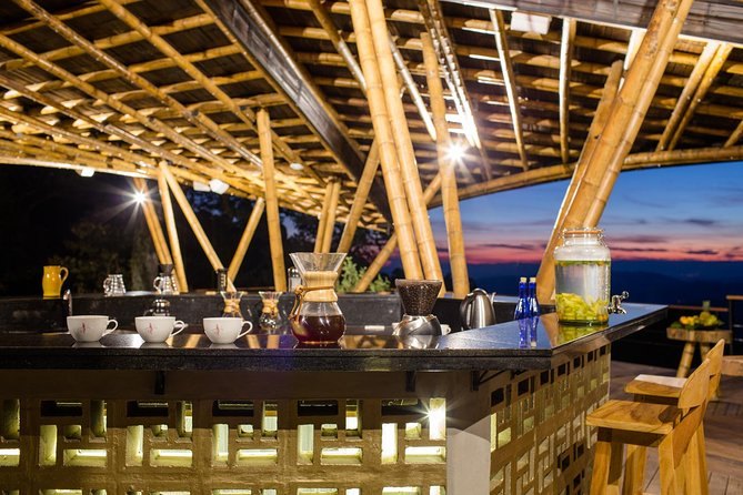 An open-sided bamboo pavilion set up as a coffee tasting room